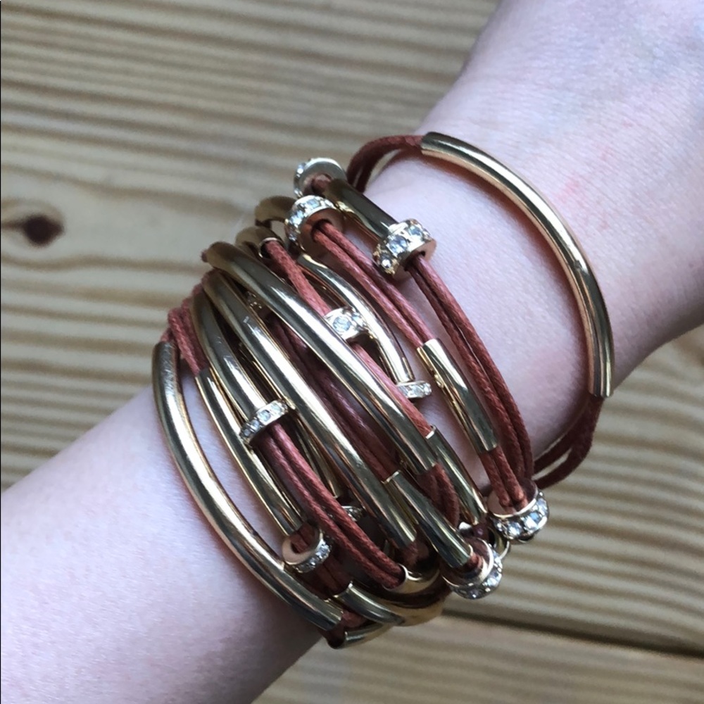 Beautiful multi layer tan strap bracelet with gold